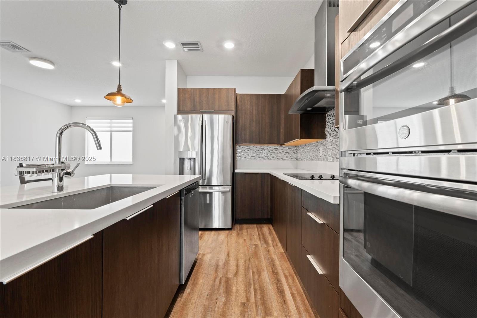 Exceptional 4-bedroom, 3-bath townhome in Doral’s vibrant community. Features include a spacious 2-car garage, tech-savvy NextGen suite with private entrance, deluxe stainless-steel appliances, quartz countertops, dual living and family rooms, powder room on first floor, and a large patio—ideal for entertaining.