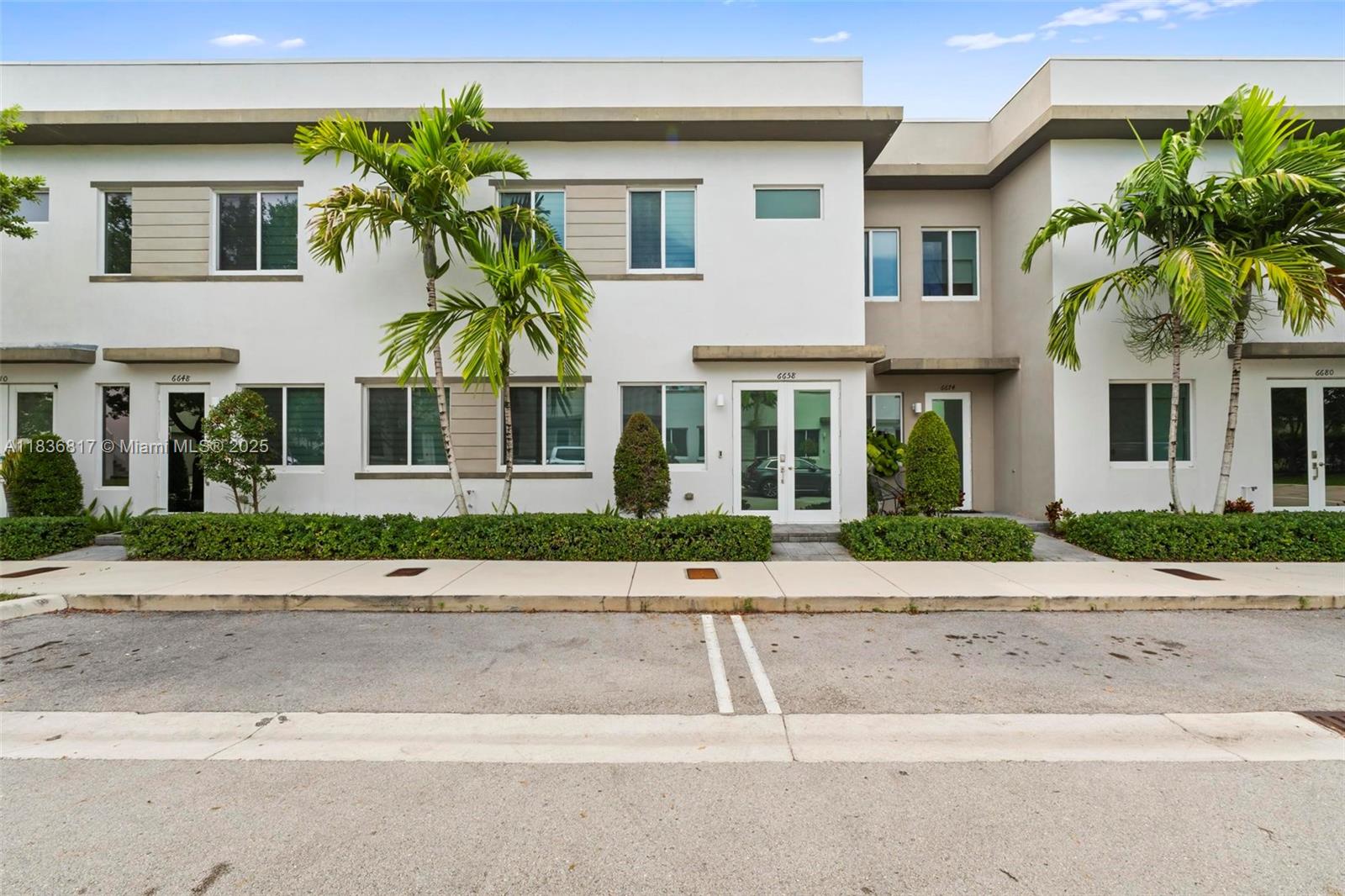 Contemporary 3 bedroom, 2.5-bath townhome in the heart of Doral. This spacious home features an open-concept layout with modern tile flooring, a gourmet kitchen with quartz countertops and stainless steel appliances, expansive living and family rooms, and a powder room on the main level. Upstairs offers generously sized bedrooms, including a luxurious primary suite with a walk-in closet and spa-style bath. Enjoy outdoor entertaining on the private patio and the convenience of a 2-car garage. Located in a secure, well-maintained community near top-rated schools, shopping, and dining.