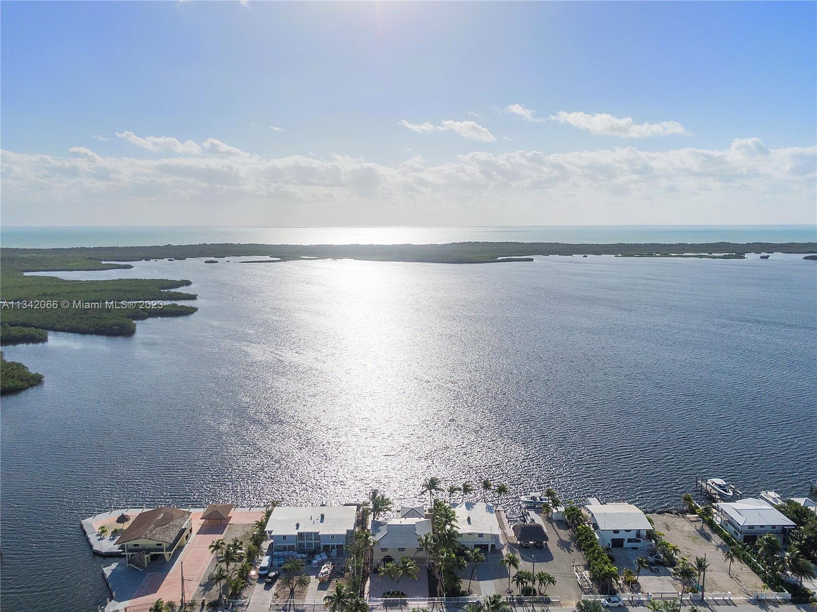 Amazing open water home on Island Drive in Key Largo. Largo Sound is an hour away from Miami and Island Drive is the areas most special street. This three bedroom/ three bathroom home has an amazing downstairs hobby room with a direct ocean view.
The home is completely remodeled and ready to enjoy. The home is fenced and gated to make sure your pets have freedom. The property has a great cut out to house your boat in addition to its concrete dock. This is a boaters dream home.