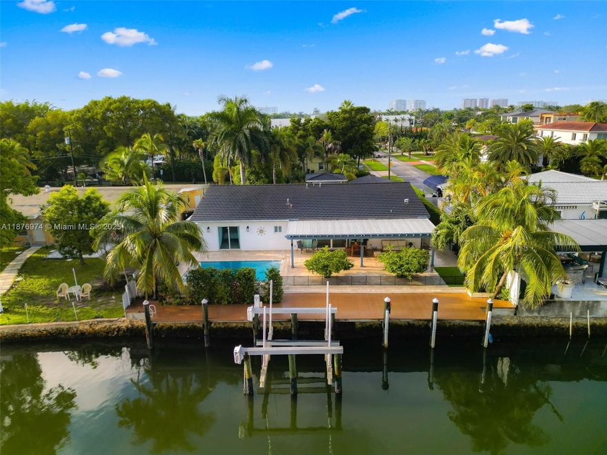 Escape to a lifestyle where every day feels like a vacation. This incredible waterfront home on Keystone Islands is a true boater's dream, perfectly positioned on a wide canal with 75 feet of water frontage and direct ocean access—no bridges to slow you down!
This home is designed for seamless indoor-outdoor living and effortless entertaining. Step outside to your own private oasis featuring a stunning 2020 heated pool, a large covered patio perfect for al fresco dining, and a 20,000 lb boat lift ready for your vessel. The lush, resort-style backyard offers the perfect backdrop for hosting gatherings or simply unwinding by the water.
Newer roof, pipes and updates throughout. A Beautiful Miami Home. Make it Rein.