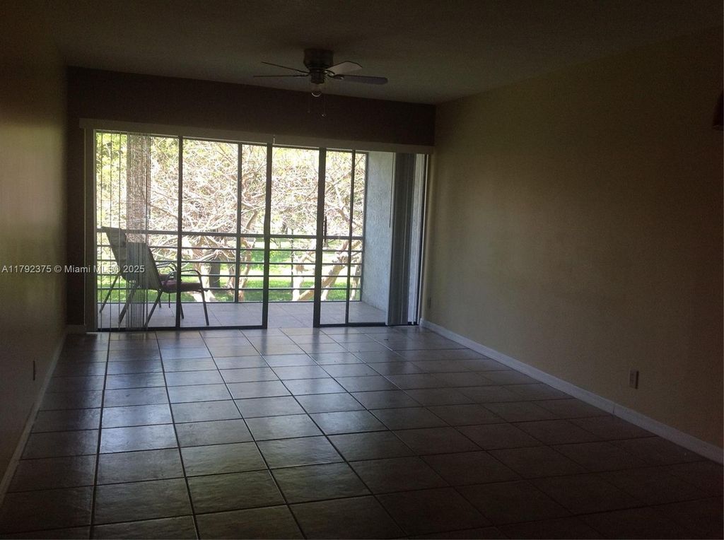 Photo of 1921 W Woolbright Rd #B202, Boynton Beach, FL 33426 (MLS # A11792375)