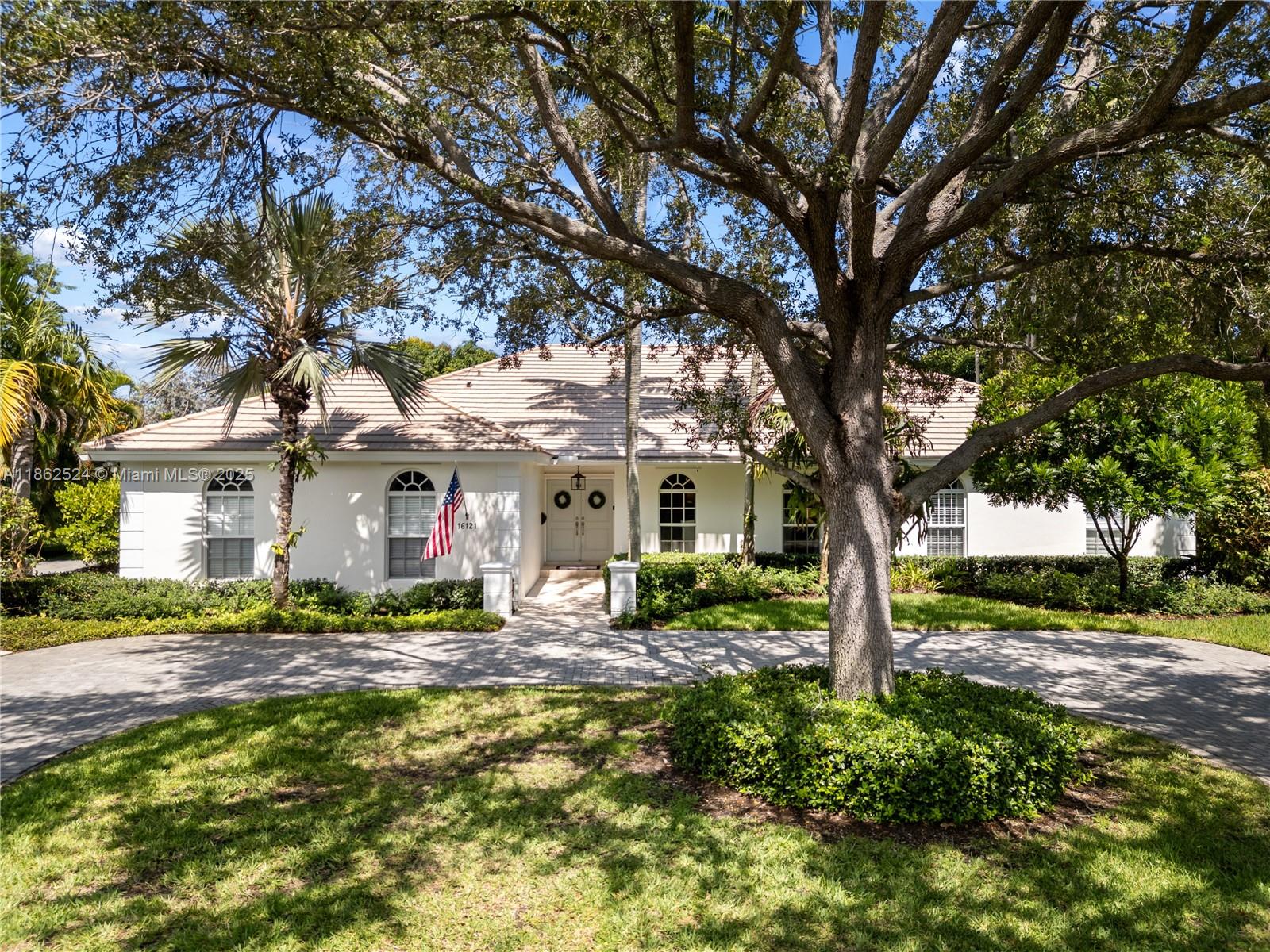 Palmetto Bay Perfection! This stunning move-in-ready home is perfect for entertaining or family quiet time. Situated on a spacious lot, this 5BD / 3BA features wood flooring, custom woodwork throughout, newly renovated light and bright chef’s kitchen with white cabinetry, quartz countertops, and stainless steel appliances. Vaulted ceilings and generous windows add drama and light, and the cozy indoor living room has a custom-built wall unit & fireplace. Easy year-round al fresco living on the pool/patio w/outdoor kitchen and inviting seating area. New driveway, PVC pipes, 2 AC units, 2 water heaters, and an indoor laundry. Lush landscaping with timed lights & sprinklers. Ideally located in central Palmetto Bay near schools, parks, restaurants, and amazing neighbors. This home has it all!