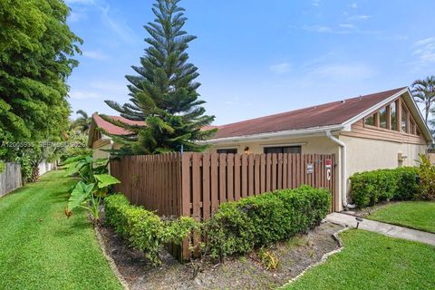 Photo of 4397 Woodstock Dr #C, West Palm Beach, FL 33409 (MLS # A12005935)