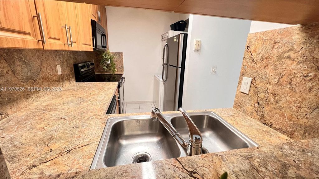 Photo of 809 Twin Lakes Dr #32-A, Coral Springs, FL 33071 (MLS # A11979826)