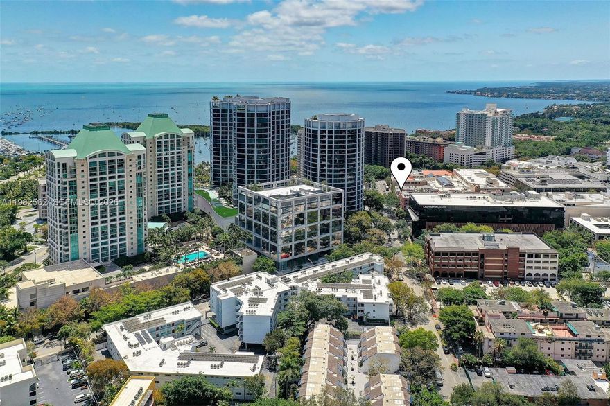 Loft style 1BR/1 DEN/1BA condo in the heart of Coconut Grove! Fully and tastefully furnished and equipped.  Blocks away from shopping, restaurants, Peacock Park and Grove Marina.  2 utility closets.  Features updated kitchen with SS appliances, granite counters and large living-dining area. Spacious master w queen bed with large closet and extra closet, den has single bed. Washer/dryer in unit. 1 parking spot in gated garage. Great space with beautiful natural light. Unbeatable location!