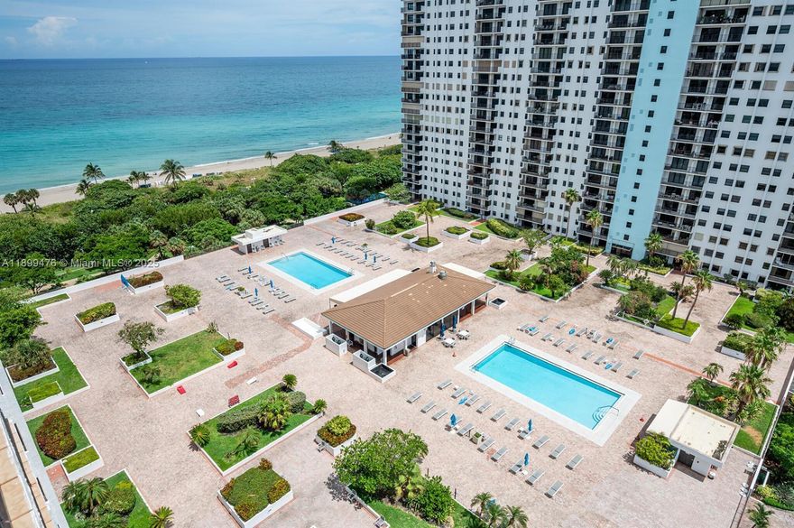 Indulge in unparalleled beachfront living in this exquisite corner high-rise residence. With additional windows enhancing the space, enjoy panoramic views of South Lake to the west and the Intracoastal Waterway to the south,and atlantic to the east offering stunning water vistas and magnificent sunsets. This mostly furnished unit features a fully equipped kitchen, a master bedroom with a king bed, and a guest room with twin beds, W & D. Residents will relish world-class amenities, including two heated pools, a fitness center, tennis courts, bocce, shuffleboard, basketball, beach service, and an on-site restaurant, all on nine acres of lushly landscaped grounds.  Fenced and gated this property is safe & secure,  Available for annual rental at $3,750/month, your perfect coastal retreat!