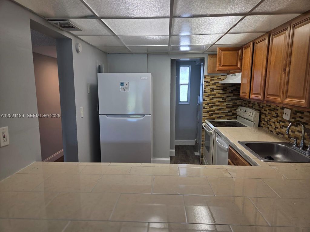 Photo of 8060 N Colony Cir N #103, Tamarac, FL 33321 (MLS # A12021189)