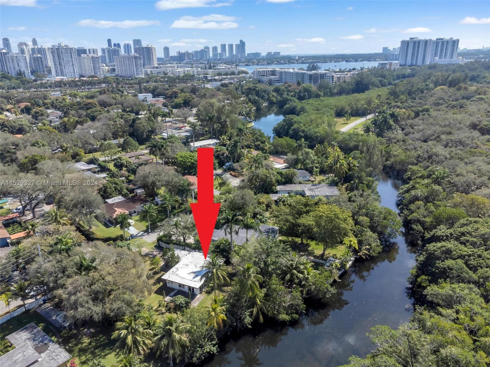 Waterfront property right on the Oleta River across from Greynolds Park. Property sits on an extra large (13,400+ SF) gated lot with 3 bedroom/2 bathrooms, updated kitchen with SS appliances and granite countertops, impact windows and doors.  This property awaits the perfect owner to turn it into their dream home. Please note the 3rd bedroom and 2nd bath are a garage conversion.