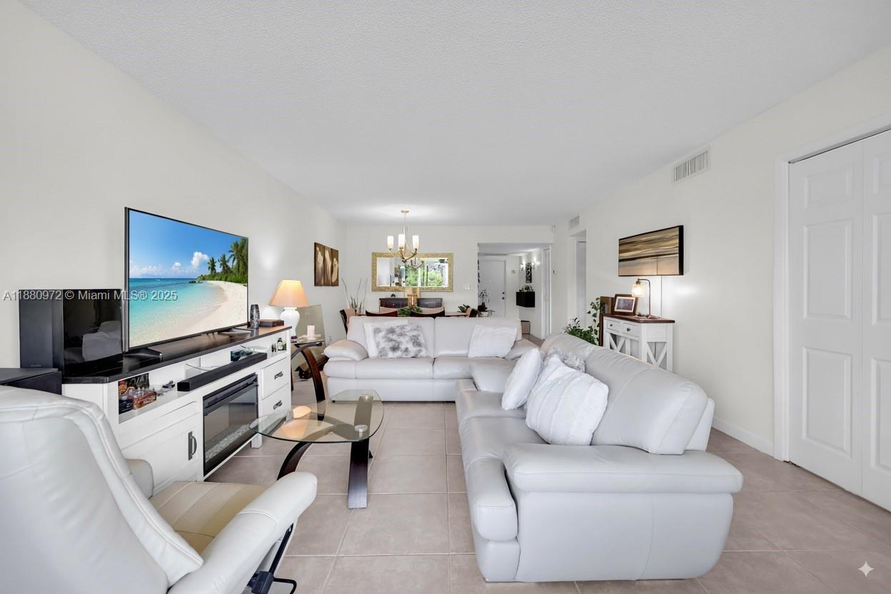 Welcome to this beautifully remodeled 2-bedroom, 2-bathroom condo in the desirable Palm Aire community! Located on the first floor, this stunning home boasts breathtaking views of the golf course right from your private patio. Perfect for enjoying Florida's beautiful weather and serene surroundings. This unit features updated kitchen, new electric panel, SS appliances, quartz countertops, and lots of storage. The spacious living area is perfect for entertaining or relaxing. Both bedrooms are generously sized with plenty of closet space both with their own private bathrooms. Washer and dryer in unit! Palm Aire offers great amenities, including multiple pools, fitness center, walking pathways, and easy access to the golf course.