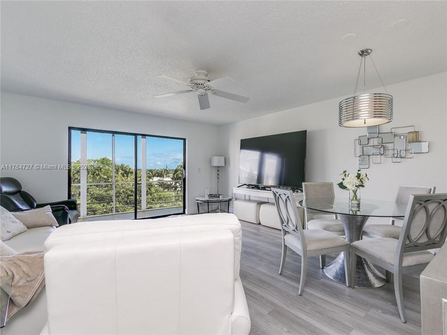 Renovated top floor unit with upgraded kitchen and bathrooms. Wood cabinets + quartz. backsplash, dual sink. Impact windows. Bright and airy living room with spacious screened in patio overlooking pool, garden & golf course areas. Quality vinyl laminate throughout. New water heater. Lots of closet space. Extra storage. Living room furniture is included in the price.                                                       Amenities: club house, gym, billiards, sauna, pool & BBQ area. New elevators. Passed 50 year certification. Special assessment is $171.77/month for the next 4 years. 55+ community. Near shopping, malls, casino, restaurants, Walmart, beach, free city bus line. No rentals allowed during first 2 years of ownership.