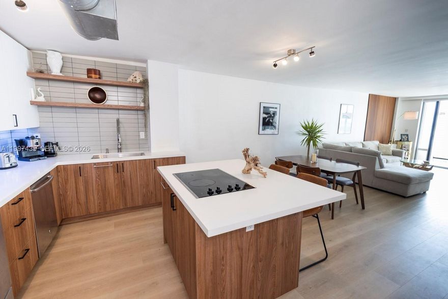 Spacious, fully renovated and furnished 1-bedroom plus den/office, 2-bath residence at Boston Plaza in North Beach. This 945 sq ft unit offers a flexible den ideal for a home office, a private balcony, abundant natural light, and updated modern finishes throughout. Enjoy building amenities including a rooftop pool, secured entry, and assigned parking. Ideally located just moments from the beach, shopping, and dining.