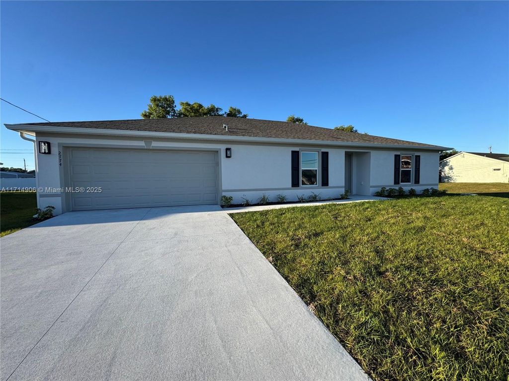 Photo of 2774 SW Ann Arbor Rd, Port Saint Lucie, FL 34953 (MLS # A11714906)