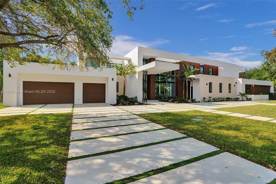 Contruction Just Finished! Stunning modern home in prestigious Pinecrest, on a lushly landscaped 35,370 sq ft lot. This architectural gem features floor-to-ceiling windows, seamlessly integrating interior and exterior spaces. With a total 10,356 sq ft of luxurious living, it includes 7 bedrooms, 8.5 baths, 3-car garage, gym, den. A breathtaking entry with a floating staircase over a sleek interior garden. The double-height great room with luxurious wine cellar and bar overlooks a tranquil water feature, leading to an outdoor entertaining area. The open gourmet kitchen, equipped with top-of-the-line appliances, flows into an expansive family room. A spacious covered terrace with a fully equipped outdoor kitchen overlooking the pool, spa, and lush backyard make it perfect for entertaining.
