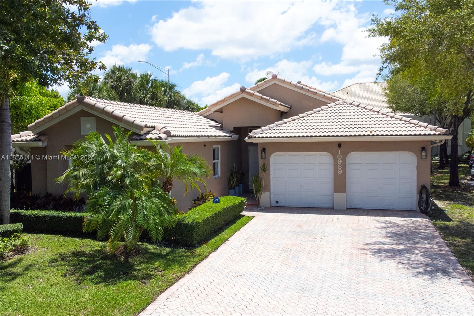 Beautifully updated 1-story pool home in the community of Doral Isles! Ideally located at the end of a quiet street with no front or side neighbors, this home features an extra-long driveway and is conveniently near two guest parking areas. Upgrades include modern flooring, kitchen, baths, lighting, and full impact windows. Enjoy a fully fenced backyard oasis with private pool and outdoor kitchen/bar. Doral Isles offers resort-style amenities: 5 lakes for great views and recreation activities, a clubhouse with restaurant, 2 pools, gym, tennis, basketball, soccer, baseball, volleyball, and 2 beach-style sunbathing areas. A rare opportunity in one of Doral’s most exclusive communities!