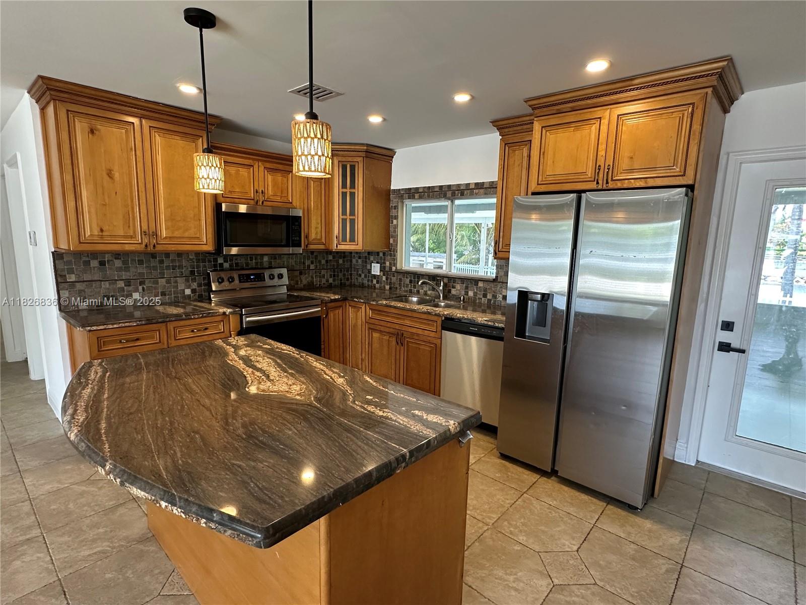 Beautifully remodeled 3 BR/ 2 Bath.Huge back and front Yard. Large screen patio with view of canal. Located just minutes away from the Hard Rock and with easy access to major roads, this home is perfect for those looking for a prime location.Everything has been updated. landscaping, fresh paint, new fence.