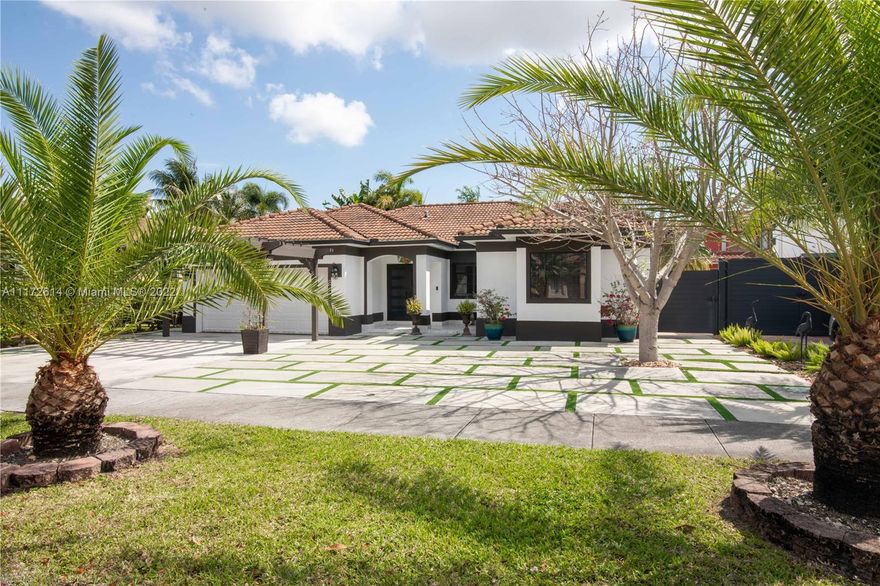 Beautiful three bedroom and two bath home on oversized lot with an amazing patio, where you can enjoy an almost NEW HOT TUB while you can make a delicious bbq in a custom outdoor kitchen, located in desired Wonderly Estates. Fully remodeled with a formal living, dining & family room, marble floors. Impact door and windows. NO HOA .This home is surrounded by Grade A schools within walking distance from the house. A MUST SEE HOME!