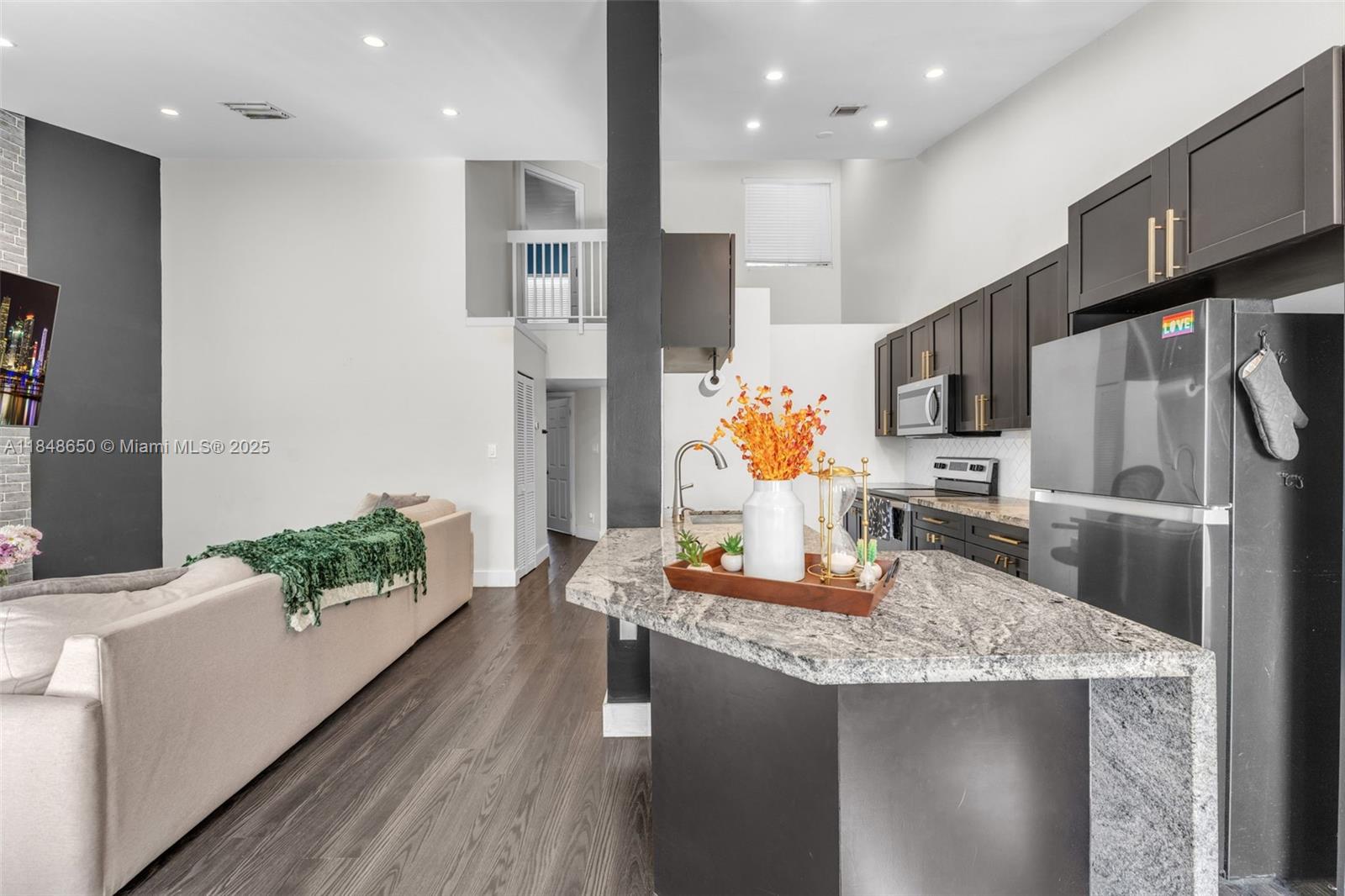 Welcome to this fully remodeled 2-story condo in a serene, tree-lined gated community in the heart of Kendall. This 1,312 sqft unit features two spacious master bedrooms—one on each floor—each with a full bath, ceiling fan and walk-in closet, ideal for flexible living. Enjoy an open-concept layout with high ceilings, modern finishes, and a sleek kitchen with stainless steel appliances and granite countertops. The main entrance is privately located on the second floor, leading to a screened balcony perfect for relaxing. Washer and dryer in-unit for added convenience. Resort-style amenities include multiple pools, clubhouse, gym, tennis courts, and beautifully maintained grounds. Move-in ready and centrally located!
