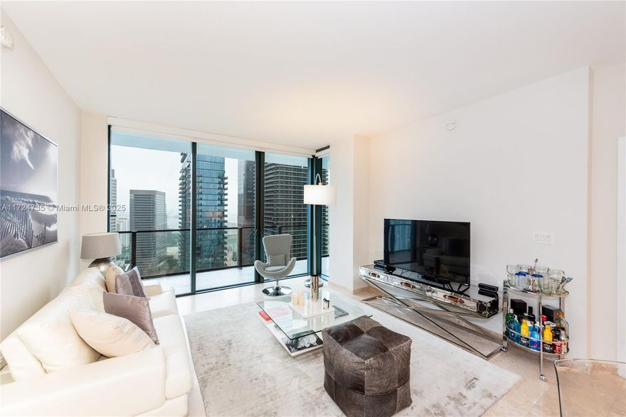 Stunning east-facing 2-bedroom, 2 1/2-bath designer residence featuring an expansive terrace with breathtaking views of Biscayne Bay and the Miami skyline. Each generously sized bedroom offers spacious bathrooms and walk-in closets. The unit boasts high ceilings, marble flooring throughout, a modern Italcraft kitchen with top-of-the-line finishes, premium Bosch appliances, a built-in 48-bottle Uline wine cooler, designer Danze faucets, and a Duravit Senzawash system in the master bath. This sleek 43-story tower offers a private lobby, 24-hour valet, concierge services, and an expansive half-acre amenity deck with a heated pool, fitness center, children's play area, spa/sauna, and grilling station. The unit is currently leased at $5,500 per month until January 13, 2026.