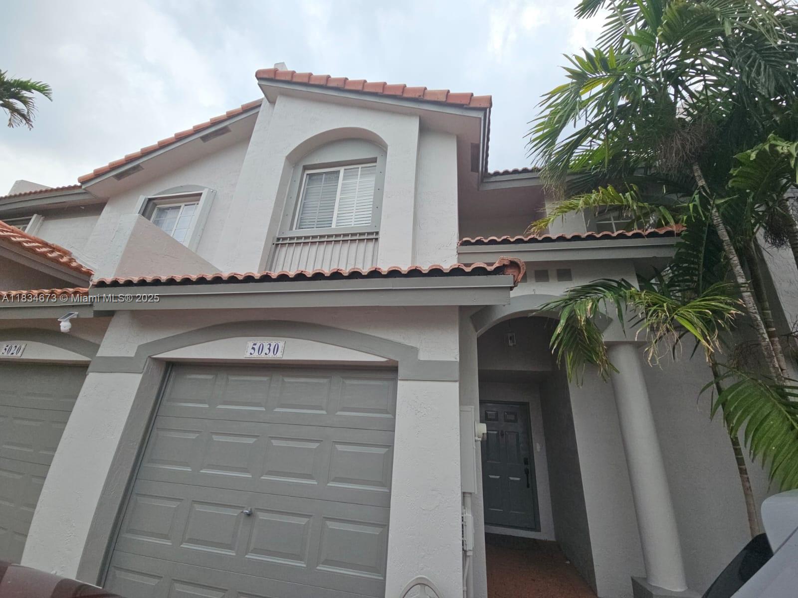 Prime Location! Beautiful 3-Bedroom, 2.5-Bath Townhouse in the desirable community of Doral Landing West. This spacious home features an open-concept kitchen with wood cabinetry fully integrated with the living room and the Patio. Enjoy tile flooring on the first level and wood flooring upstairs. The unit includes a washer and dryer, 1-car garage with two additional parking spaces directly in front of the property, plus ample guest parking. Situated in a private, gated community with 24-hour security, a community pool, and various amenities. Conveniently located near major roads and the Turnpike, Miami Dade College West Campus, top-rated (A+) schools within walking distance, and just minutes from the airport, dining, and shopping centers.