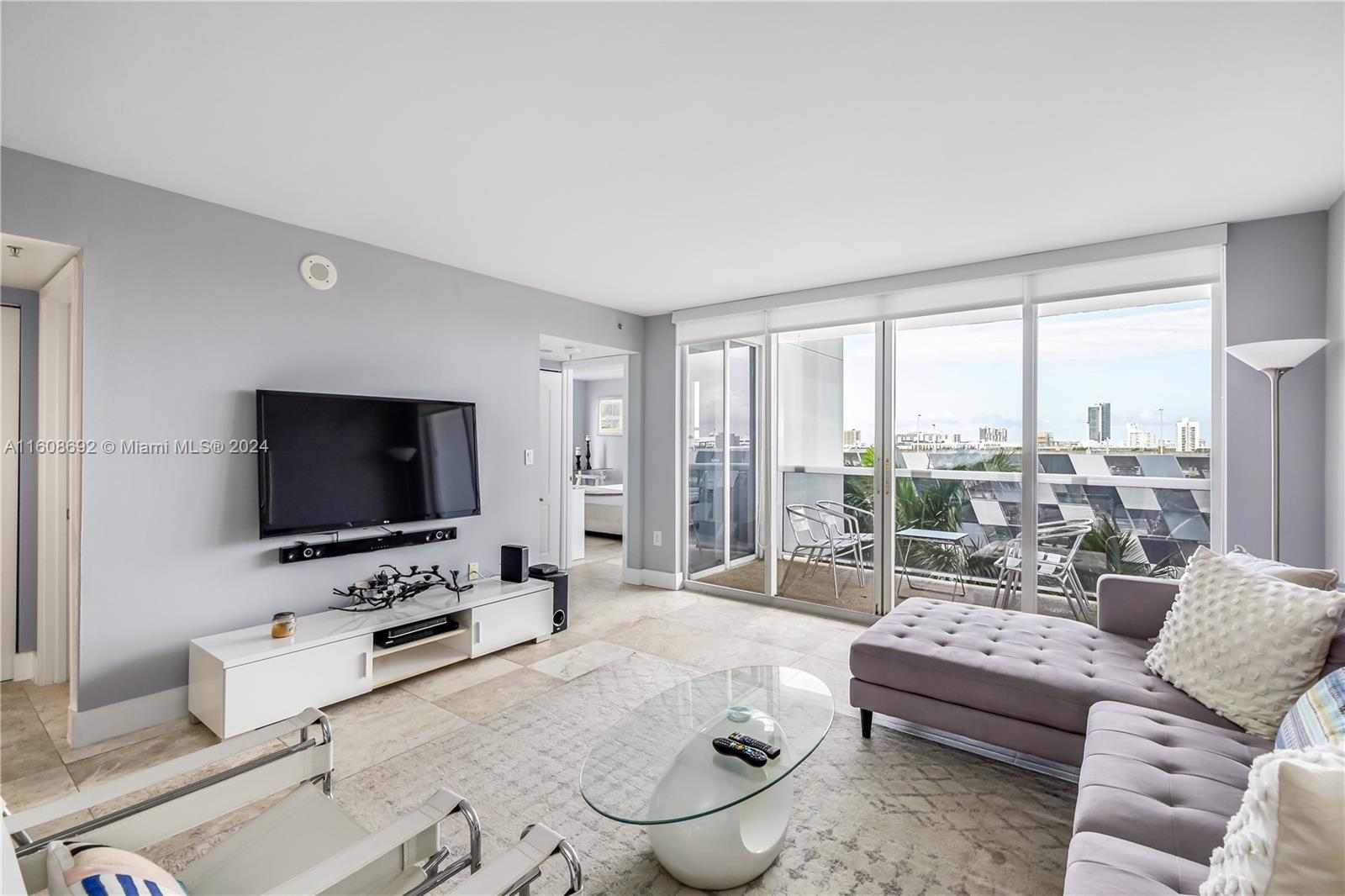 FURNISHED ANNUAL AND AVAILABLE!  Easy living at Sunset Harbour at a reasonable price . Close to best resaturants, fitness boutiques and galleries. Private marina and bay walk out your back door. NE corner 2/2 with modern beach-house décor, completely furnished for quick occupancy. Bright unit with city skyline + palm tree views (because lower floor) . Located on the resort-deck level which puts the pool, gym and "work from home" clubhouse on the same level. Tile floors, smooth ceilings, in-unit laundry, white kitchen, 2 balconies, 1 garage space. Doorman + valet. Great layout for roommates and work from home. Professionally managed and NOT for sale. Renewals welcome. Immediate occupancy but annual furnished only.  Sorry, landlord has declined six month offers already.