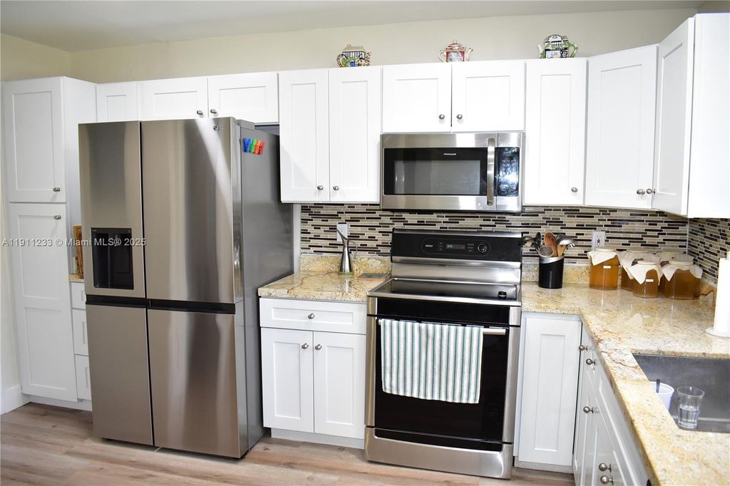 Photo of 4867 Hawkwood Rd #B, Boynton Beach, FL 33436 (MLS # A11911233)