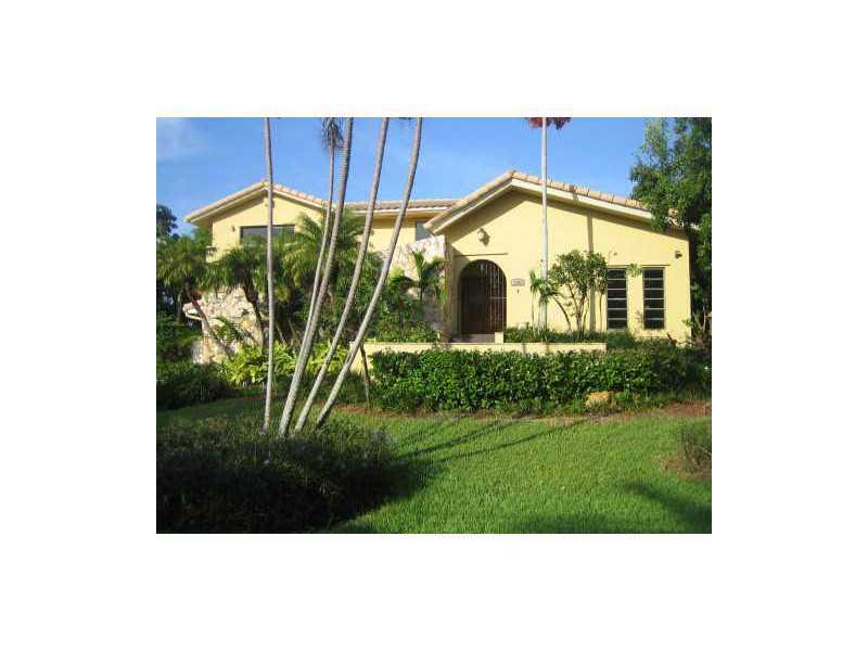 Exclusive manned and gated Sunrise Harbour on the Bay.  Direct Ocean access, no bridges to bay, 79 ft. of seawall; corner lot.  Updated beautiful home.  Volume ceilings in living and family rooms.  2nd story master bedroom with balcony.
