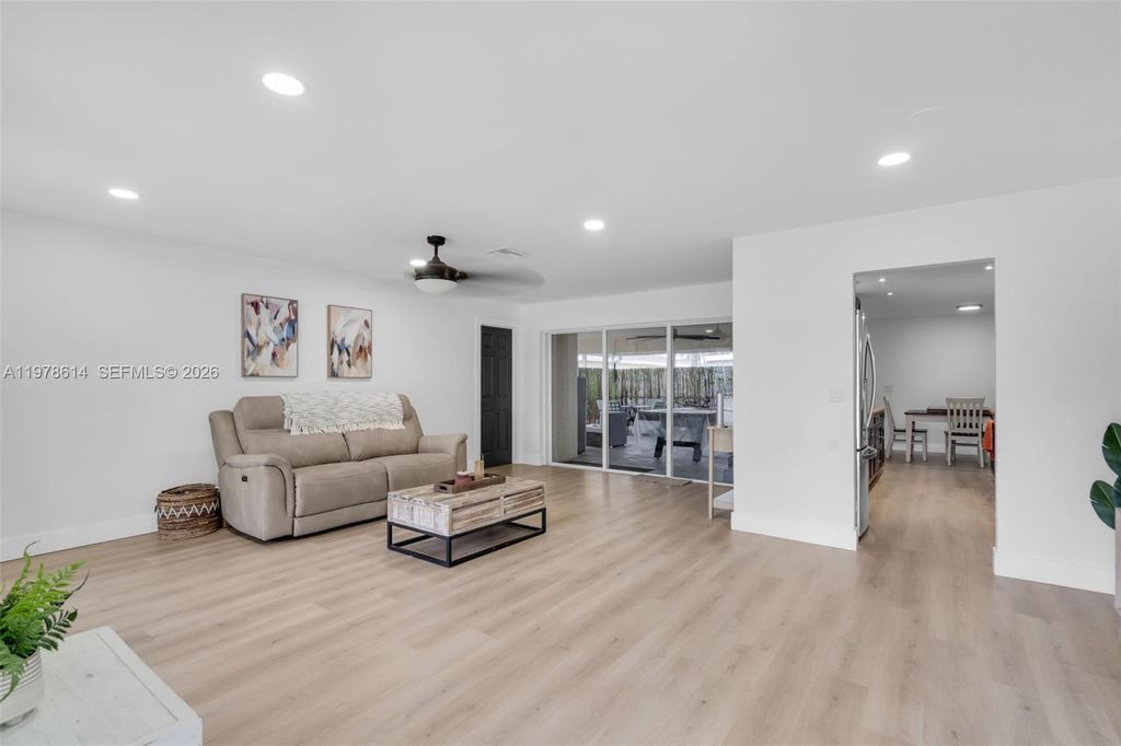 Photo of 1180 NW 49th Ct, Deerfield Beach, FL 33064 (MLS # A11978614)