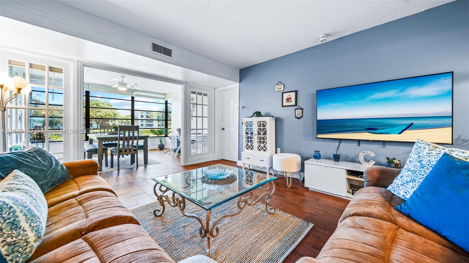 Beautifully updated 2-bed, 2-bath condo in Whitehall at Pine Island Ridge. Enjoy peaceful lake views, a modern kitchen and baths, full-size washer/dryer, extra storage, and a flexible space for dining or home office. This move-in-ready unit sits in a preserve-like setting with access to walking trails and green space. As a resident, you’ll enjoy full access to the Pine Island Ridge Country Club—featuring golf, tennis, a resort-style pool, fitness center, and on-site restaurant. All just 20 minutes from downtown Fort Lauderdale and 30 from Miami. HOA fee includes water, cable, exterior insurance, and all club amenities. No leasing for first 2 years—ideal for end users seeking a tranquil, well-kept community. No Assessments!
