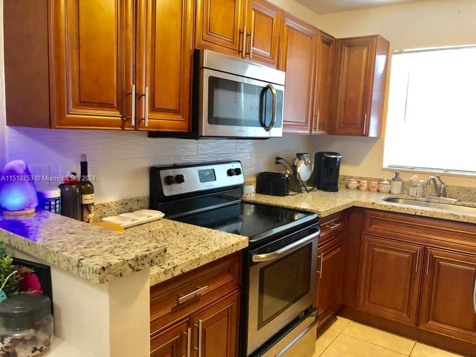 Spacious upgraded in highly desirable residential area. Tiled throughout with lots of closet space. Large new open Kitchen. Central AC, Laundry facility onsite. assigned parking space .Rent including water Easy approval.