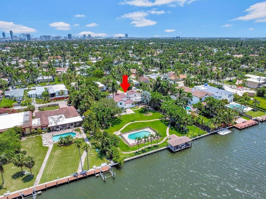 Welcome to your own oasis! This stunning single-family home is situated on over 35,000 sq ft of land. This beautifully maintained Mediterranean-style house is fully furnished and features 5 bedrooms, 3 full bathrooms, and a 2-car garage. Enjoy relaxing by the gorgeous pool while overlooking the intercoastal waterway, with no fixed bridges to the open ocean—perfect for boating enthusiasts. The property is also conveniently located just a 10-minute walk from the ocean.