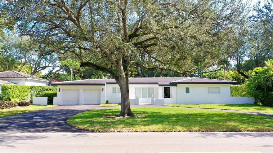 Discover a spectacular move-in ready home in the highly coveted South Gables. This 3-bedroom, 2-bath peaceful oasis exudes calmness and serenity from the moment you walk in with 2,536 adjusted square feet of elegant space on an expansive 11,000 sq ft lot with spacious 2-car garage and circular driveway. This home has been completely remodeled with new roof, impact windows/doors, and high-end finishes including  a stunning open kitchen equipped with Thermador appliances, a new 5-ton A/C system with linear vents, new electrical and PVC plumbing, modern designer bathrooms, and custom closets throughout. A seamless blend of comfort and sophistication, this residence delivers elevated Coral Gables lifestyle at its finest. Fall in love with the mature oaks surrounded by artificial turf and putting green in the back yard with plenty of room to expand. Located on a beautiful tree-lined street, walking distance to University of Miami and Jaycee Park, this home is minutes from Coconut Grove, Merrick Park and the best schools in Miami. This gem has been crafted for discerning buyers seeking quality and design.