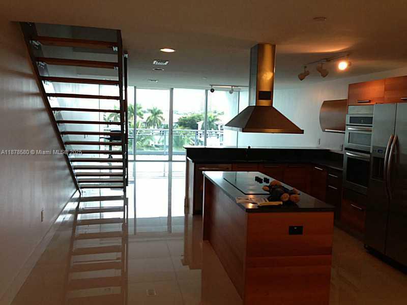 Amazing building by architect Carlos Ott. Unfurnished two bedroom duplex with den . Master suite with ample walk in closets and ensuite bath. Three balconies with amazing views. Laundry in the apartment. Ultramodern living area. Ultramodern equipped kitchen. Valet parking, Pool, fitness center, tennis courts on premises. Five minutes from beaches, near Aventura Mall, shopping,. 24 hour front desk service, two assigned parking spots. Storm protection; impact glass all around