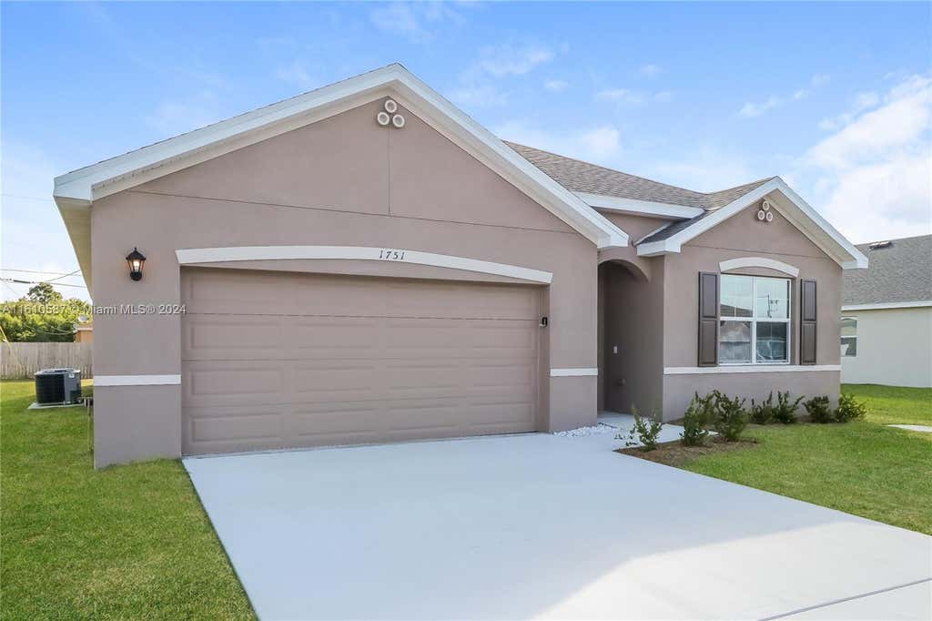 Photo of 1751 SW Gloria Ln, Port Saint Lucie, FL 34953 (MLS # A11610587)