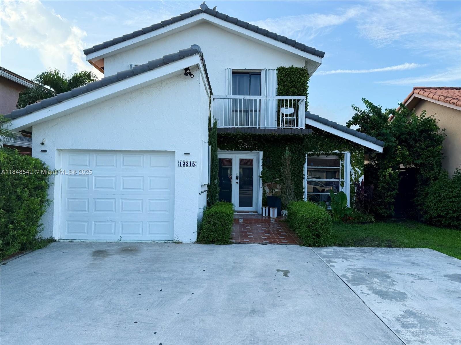 Fall in love with this gorgeous 4/3 bedroom single family home NO HOA. featuring a private in law suite with its own private exterior entrance on the ground level. The first floor features white porcelain flooring throughout, granite countertops, kitchen island, and beautiful solid wood cabinetry. Brand new barrel roof installed (2024), and the AC unit was replaced two years ago and is still under warranty. Front door is hurricane impact double doors.
Upstairs, three spacious bedrooms, two full bathrooms, and elegant dark grey hardwood floors. Accordion shutters are installed throughout, and the home is fully upgraded. New insulation was sprayed into the roof this year. MUST SEE! Macmillan Park is across the street offering endless ample parking.