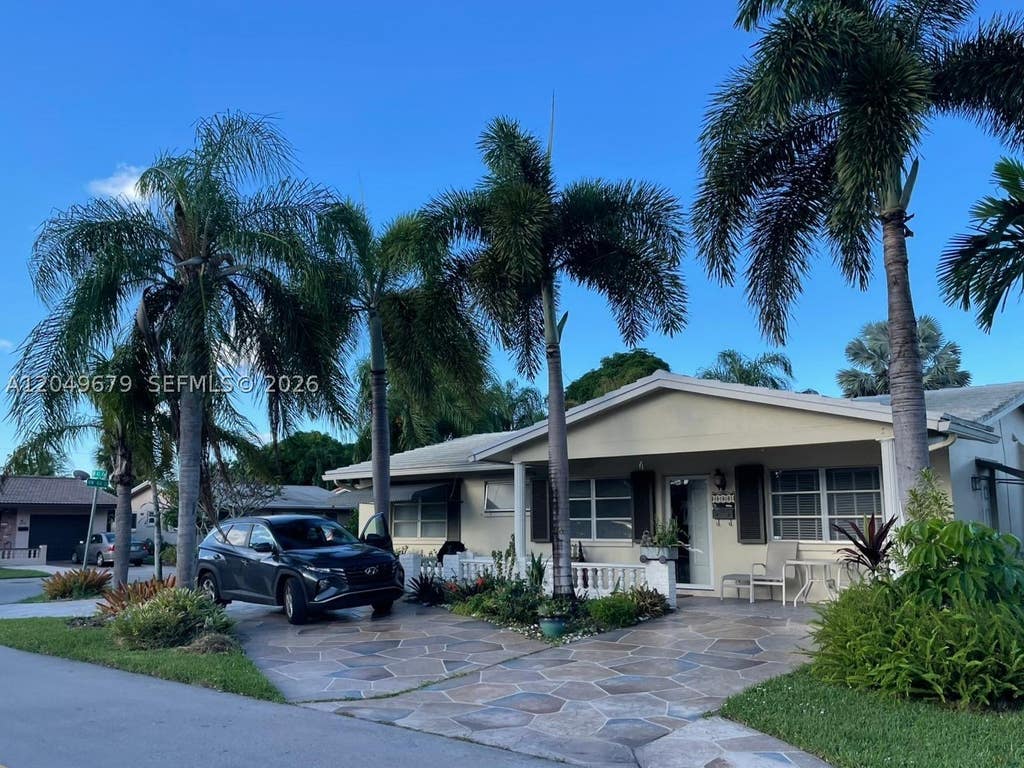 Photo of 4401 NW 43rd Ave, Tamarac, FL 33319 (MLS # A12049679)