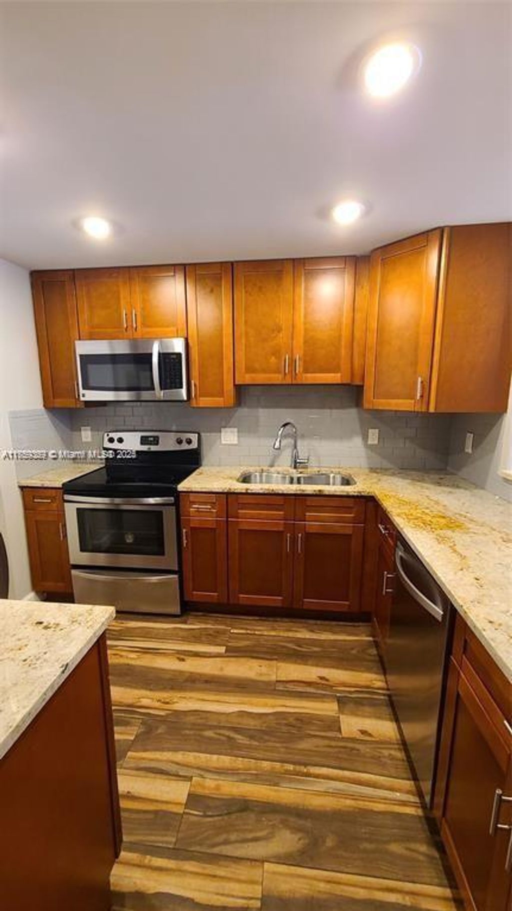 Photo of 2320 S Cypress Bend Dr #105, Pompano Beach, FL 33069 (MLS # A11759369)