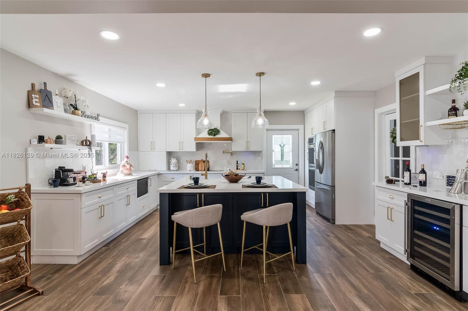 Welcome to your peaceful, privately gated 4-bdrm/3.5-bath retreat on an expansive 33,105 SF lot. Versatile living areas w/ formal living, dining & family rooms. Gorgeous, light & bright farmhouse style chef’s kitchen features quartz countertops, lg. center island w/ seating, new appliances. 3 bdrm/2 bath downstairs incl. a junior suite, upstairs is a spacious primary suite w/ vinyl flooring, opulent bath featuring wet room, double sinks, walk-in closet & lovely balcony to enjoy the beautiful views. Indoor laundry rm. Impact windows/doors, PVC plumbing and new roof. Expansive fenced yard w/ newly remodeled pool w/ travertine tile patio plus plenty of lawn space, covered terrace & shed. Plenty of parking space for your work vehicles or a family gathering. 2-car garage. Available immediately!
