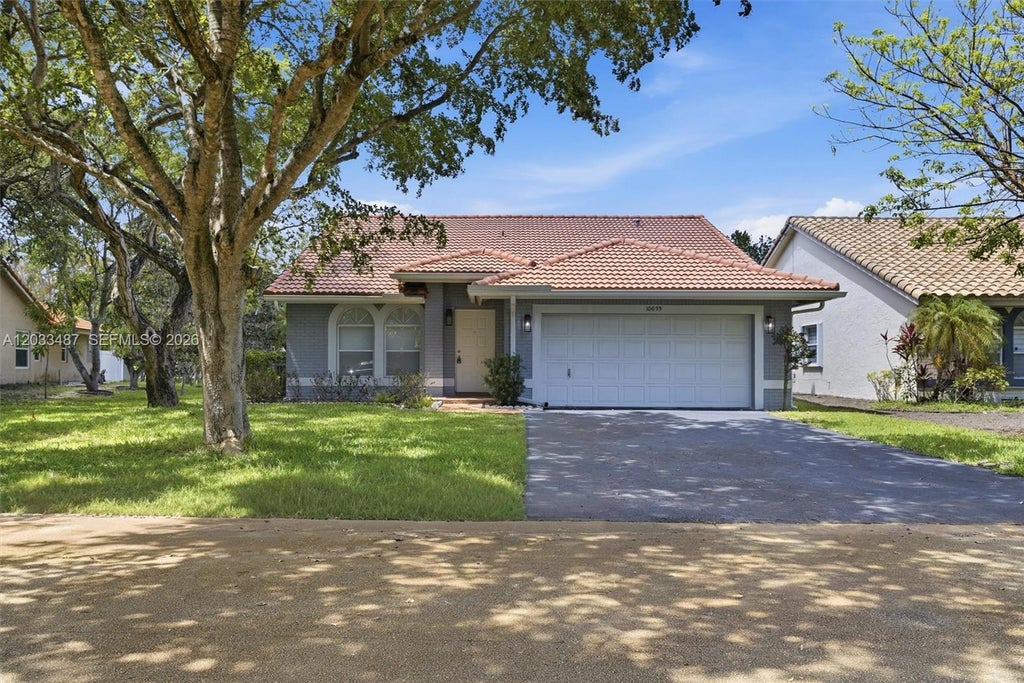 Photo of 10633 NW 32nd Ct, Coral Springs, FL 33065 (MLS # A12033487)