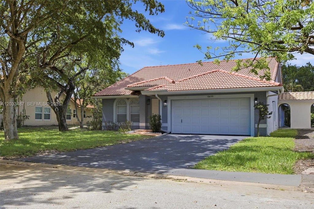 Photo of 10633 NW 32nd Ct, Coral Springs, FL 33065 (MLS # A12033487)