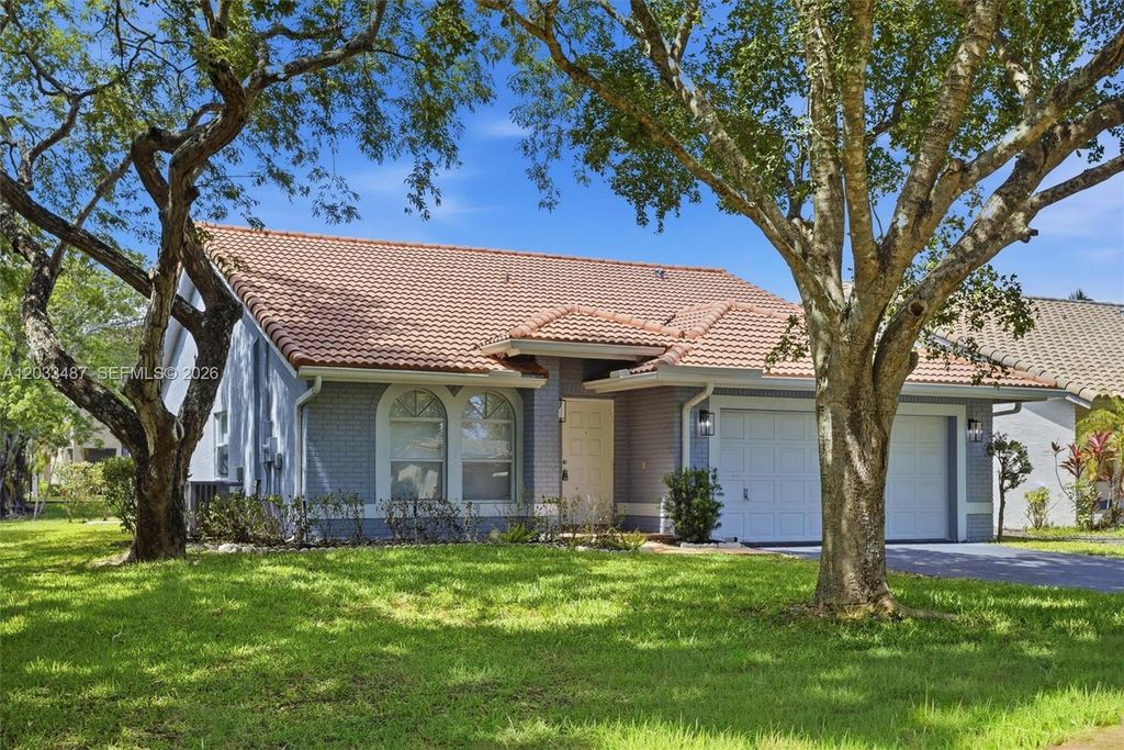 Photo of 10633 NW 32nd Ct, Coral Springs, FL 33065 (MLS # A12033487)