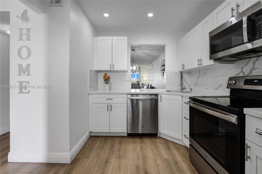Photo of 2551 Aragon Blvd #411, Sunrise, FL 33322 (MLS # A12007713)