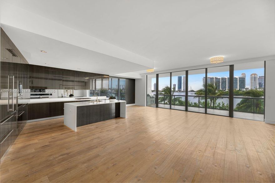 Fab residence with breathtaking Intracoastal views & joyous, natural light. One-of-a-kind Carlos Ott-designed building with 190 exclusive residences on 5 acres of prime waterfront. Private elevator. 3 bedrooms, each with private bath + den and a service suite with staff quarters, which can be a fourth bedroom. Sleek interiors with large plank premium wood floors. Subzero appliances and Wolf gas stove. Control 4 technology & Sonos surround sound. 2 spacious terraces + summer kitchen. 2 parking spaces plus valet, storage space, 24-hr security, gatehouse, and concierge. Driver services, dog walker, beach amenity, and café. The building is on a quiet cul-de-sac with a 1.5 acre park and a community rec center. This is the deal you've been looking for!