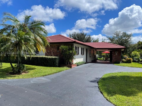 Photo of 9065 Thunderbird Dr, Coral Springs, FL 33065 (MLS # A12100401)