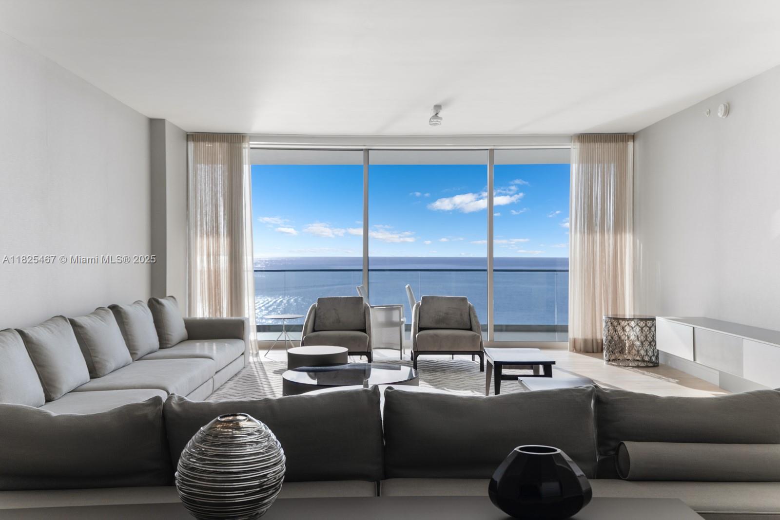 Residence 1802S at Oceana Bal Harbour offers a coveted flowthrough layout with 3,592 SF of interiors and 745 SF of terraces, featuring unobstructed ocean, bay, and city views. This 3-bedroom + staff room, 4.5-bath home includes private elevator entry, floor-to-ceiling glass, Gaggenau kitchen with eat-in island and dining area, family room, and spa-like primary bath. Expansive East- and West-facing terraces provide seamless indoor-outdoor living. Oceana Bal Harbour offers premier amenities including beach and pool service, spa, fitness center, tennis courts, and on-site dining. Includes 1 assigned space, 1 valet, and 1 storage unit.