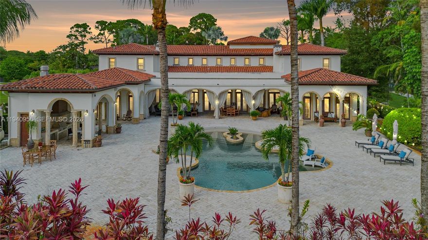 Experience authentic resort-style living in the heart of Miami, ideally located near top schools, dining, and shopping. While the interior impresses with a grand foyer, soaring ceilings, and a handcrafted staircase, the property’s true crown jewel is the spectacular outdoor oasis. Designed for effortless entertaining and relaxation, the backyard features a stunning beach-entrance pool and a fully equipped summer kitchen and barbecue area, all framed by a covered patio that invites the Caribbean breeze. Inside, the home blends classic luxury with modern peace of mind, featuring Venetian plaster, a custom bar with a wine cellar, and essential upgrades including impact windows, a diesel generator, and a 5-ton A/C unit. The layout provides exceptional comfort with a main-floor primary suite and six additional bedrooms upstairs, including a private guest suite and service quarters. Secured by a gated entrance and a four-car garage, this residence offers a private, vacation-like escape every day of the year.