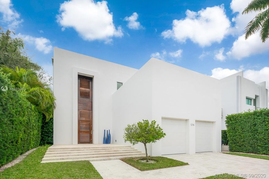 This architectural beauty is located in the secret and peaceful Isle of Biscaya, Surfside. The residence has amazing natural light provided by the stackable sliding glass doors. It has a75 feet Infinity lap pool with a waterfall. Six bedrooms, six and one half bathrooms including a coral stone cabana bathroom.
High end finishes all through out the house, 12 feet ceilings, limestone floors, elevator, coral stone walls, gourmet kitchen with Italian expansive cabinetry and large island, Italian made walking master closet, outdoor kitchen with BBQ, lounge area with a gas fire pit covered by a palm tree oasis, new Ipe wood dock, sunset terrace, two car garage, pantry, storage rooms. Beach at a walking distance. Actual 5721feet. Lot: 50 x 200 (10,000)