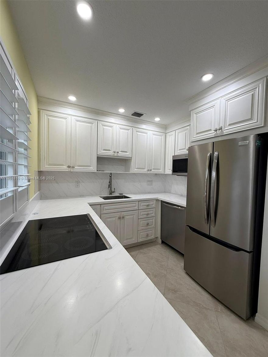 Welcome to your perfect retreat in the heart of Stuart, Florida! This inviting 2nd-floor corner unit offers a unique blend of modern comfort and exceptional convenience all within a vibrant 55+ community. The thoughtfully designed kitchen maximizes the benefits of the corner layout, creating an ideal space for cooking and entertaining. Enjoy the latest updates throughout the unit, including stylish finishes that enhance the overall ambiance. This freshly painted unit includes recessed lights with dimmers, new kitchen, new water heater, plantation shutters, new sliding door screens, 6 new ceiling fans and 4 flat screen televisions. Just 5 minutes to Stuart Beach, Elliot Museum, and Publix. Only 1 mile to the brand-new Sailfish Sands Municipal Golf Course and 2 miles to downtown Stuart.