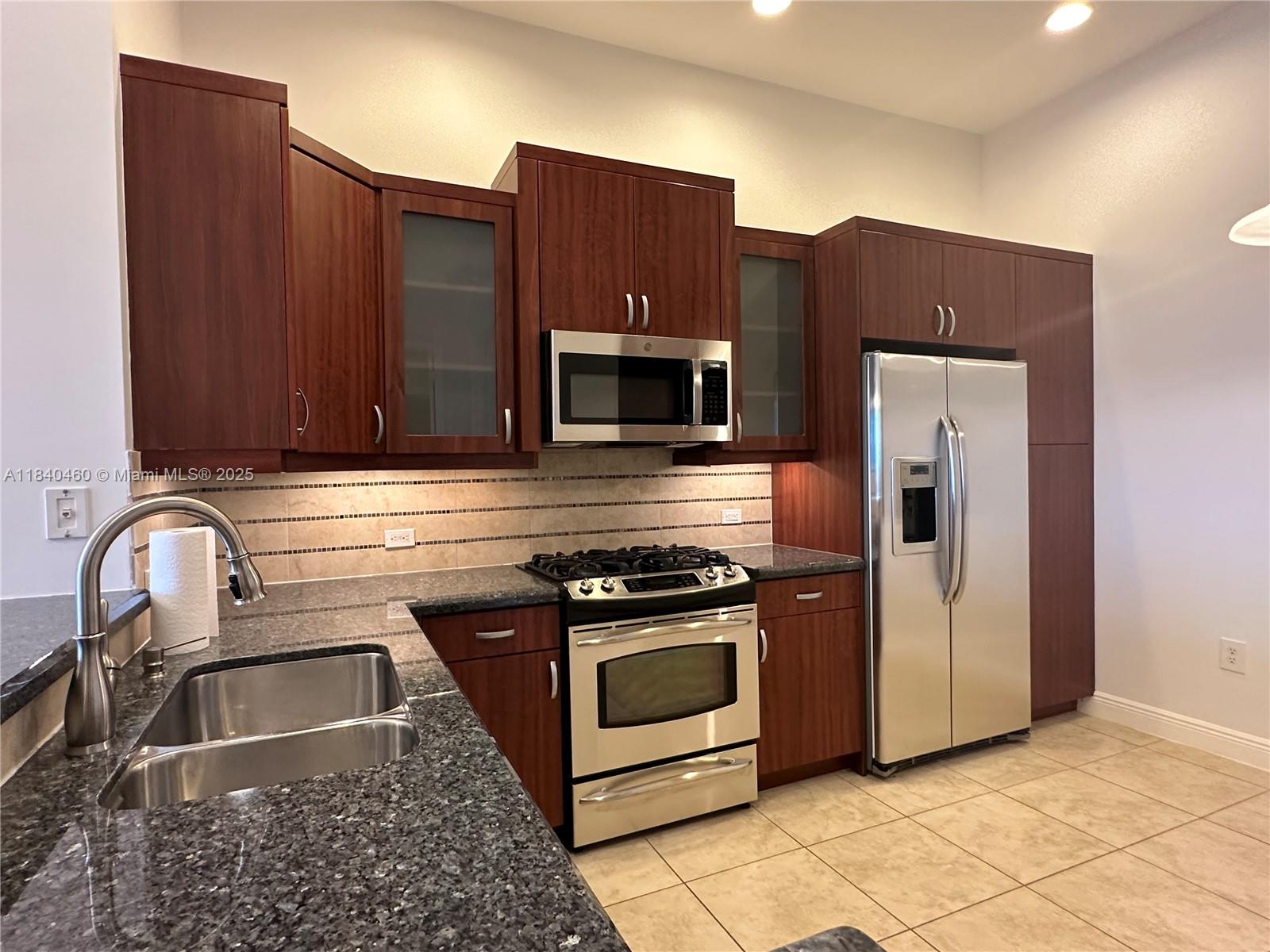 Beautiful 2/2 condo on penthouse floor, unit in mint condition, in the gated, and sought after community of ARTESIA. High quality wood floors in bedrooms, and ceramic floors throughout. Granite counter tops in kitchen and bathrooms, custom made wood California closet with safe. Hunter Douglas wood window treatments, ADT security system, gas dryer, and stove, 12' high ceilings, custom kitchen and bathrooms organizers. Full size washer and dryer inside unit. Impact windows and sliding door, security cameras in the building, 2 garage covered parking spaces, new roof, close to Sawgrass Expressway and Mall. Ready to move in.
