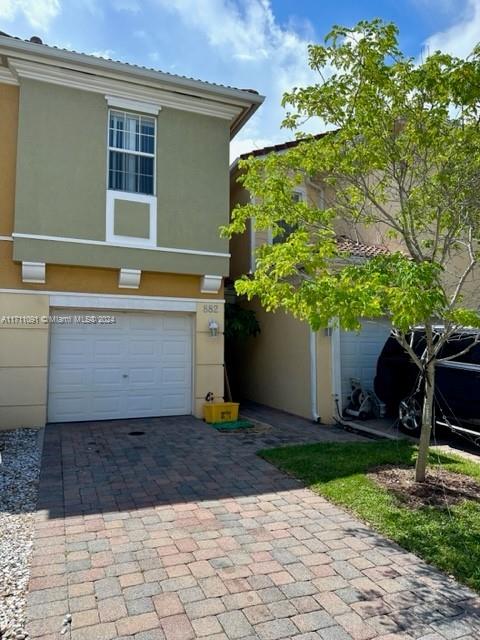 This property offers 3 rooms and 2 bathrooms and half-bath a functional layout 2nd areas full of natural light, perfect for day to day and entertainment. Modern Kitchen renovated, with granite countertops, elegant cabinets and all appliances new. Spacious living room ideal for family gathering or relaxing at the end of the day, with direct access to the patio. Master bedroom has a private spa-type bathroom and a large walk in closet. Outdoor space private backyard to enjoy barbecue or moments of tranquility outdoors. Parking private garage and additional space for visitors. Minutes from main highways (I-95 and Turnpike) shopping centers restaurants, beaches and palm beach International airport. community amenities: swimming pools, trails, green area, lake, included in the HOA fees.