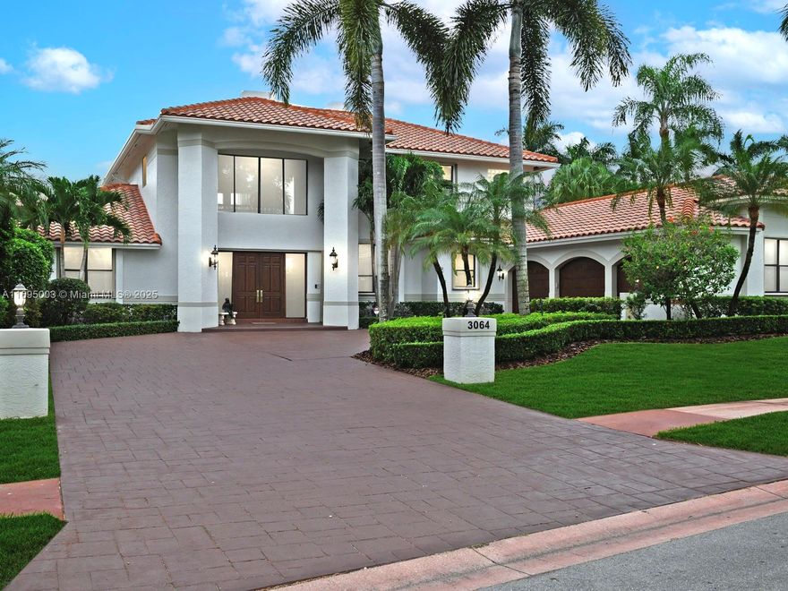 BEST LOCATION in Weston Hills! Experience luxury in The Reserve at Weston Hills. HOME WAS COMPLETELY REMODELED & EXPANDED + NEW ROOF IN 2005. Situated on 23,439 sf of pristine grounds, this estate offers breathtaking lake & golf course views. 5,260 sf, 5bd + office/6bd & 5.5 baths. High ceilings, impact windows, walk-in closets w built-ins, solid oak floors, grand foyer, elevator, sauna & 2 fireplaces. Chef’s kitchen boasts Cherrywood cabinets, Sub-Zero fridge, quartz counters, 2 ovens & dining for 12. Primary suite w sitting rm, spa-like ensuite, & balcony w sweeping views. A screened patio, 1,791 sf deck, refinished pool (2023) & NEW AC complete this extraordinary home. A+ school zone. 2005 roof in perfect condition.